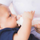 Infant being fed by a bottle daycare Milestones Learning Center Central OH