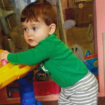 A preschooler plays in a daycare